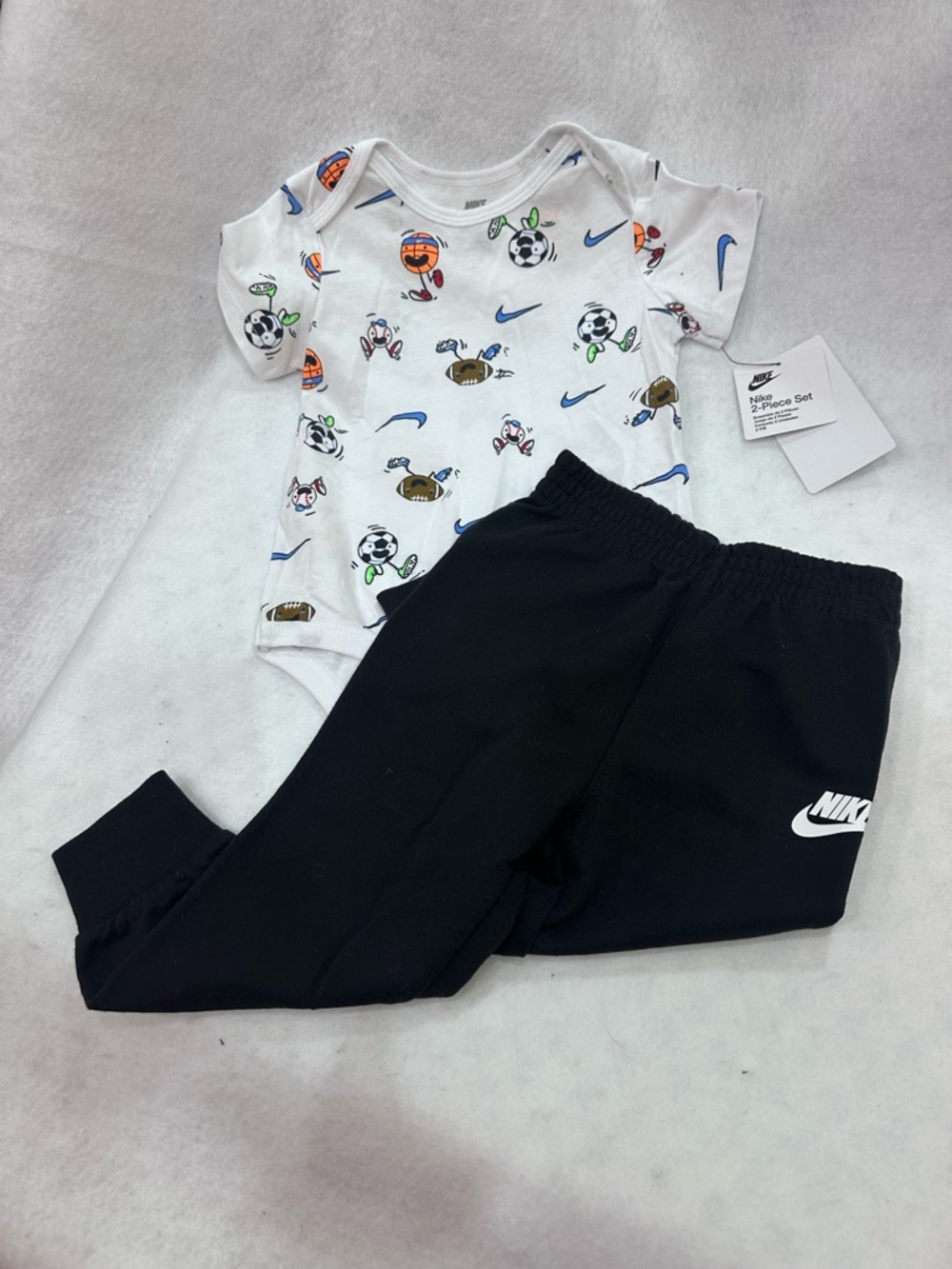 Boy’s Nike White Sports Print Bodysuit with Black Nike Logo Pants